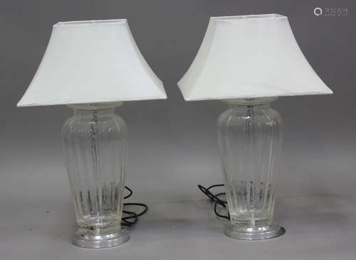 A pair of modern bubbled clear glass and chromium plated tab...