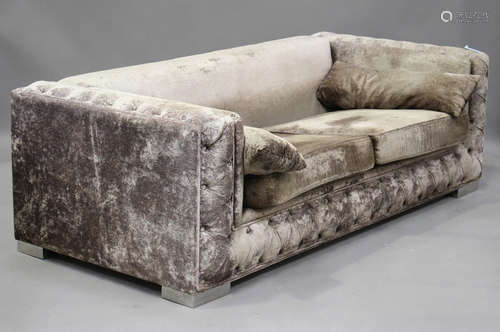 A modern two-seat sofa by Belar, upholstered in dusty pink b...