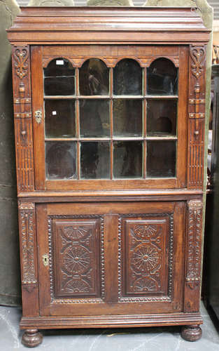 A 19th century Flemish oak side cabinet with carved decorati...