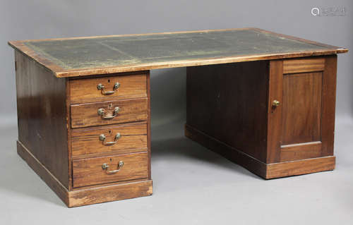 A George V mahogany twin pedestal partners desk, the top ins...