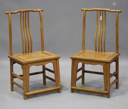 A pair of 20th century Chinese provincial softwood chairs, e...