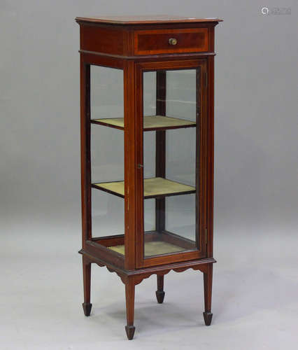 An Edwardian mahogany pedestal display cabinet with satinwoo...