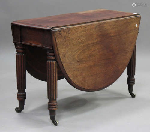 An early Victorian mahogany drop-flap dining table, raised o...