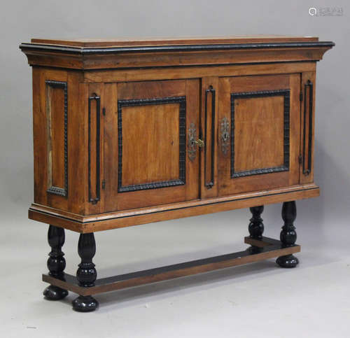 A 19th century Continental walnut side cabinet-on-stand, fit...