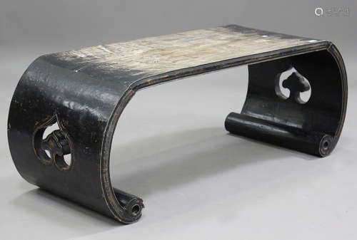 A 20th century Chinese hardwood low table of scroll form, he...