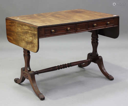 An early 19th century mahogany sofa table, fitted with two d...