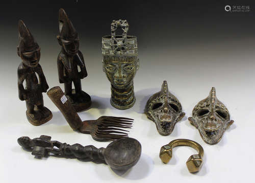 A group of African tribal items, including a pair of carved ...