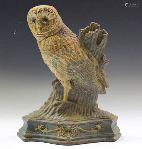 A cast iron cold painted doorstop in the form of an owl, hei...