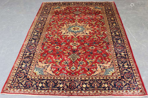 An Esfahan carpet, mid-20th century, the red field with a st...