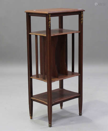 An early 20th century French walnut magazine stand with gilt...