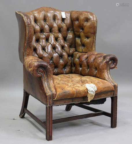 A 20th century George III style buttoned brown leather wing ...