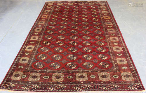 A Turkestan Tekke style carpet, late 20th century, the clare...