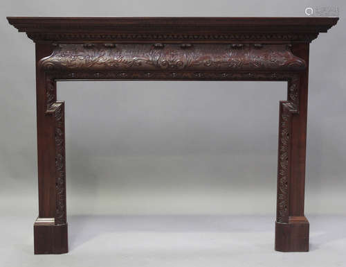 A modern reproduction mahogany fire surround with finely car...