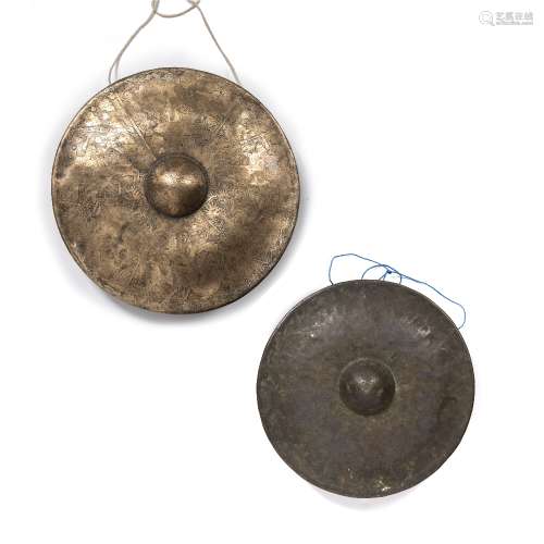 Two temple gongs Sino-Tibetan one with engraved with panels ...