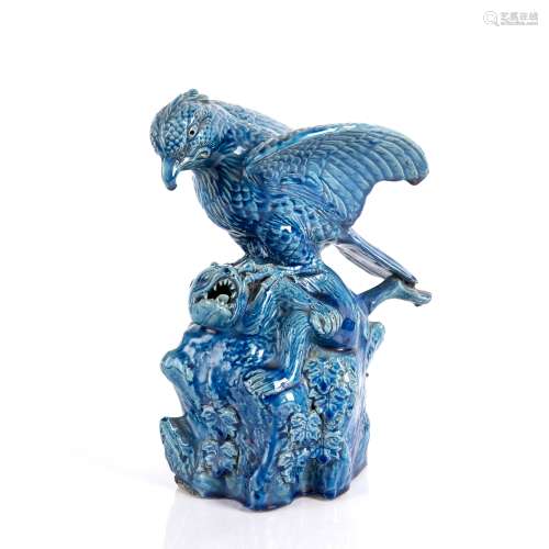 Glazed model of an eagle swooping on a dog Chinese the glaze...