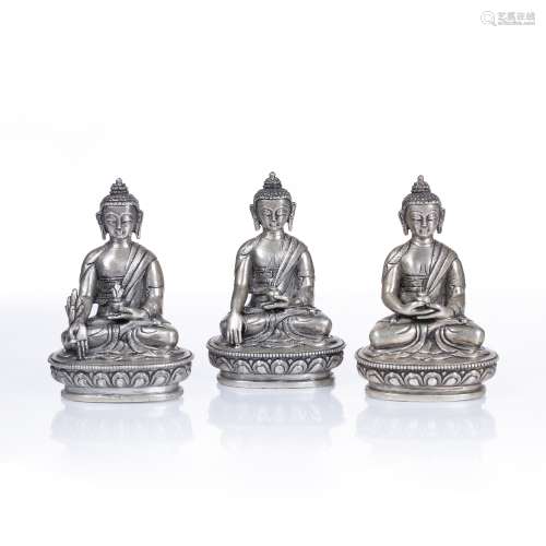 Trio of small white metal Buddhas Sino-Tibetan to include Bh...