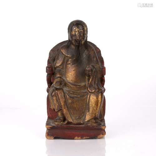 Carved wooden figure Chinese depicted sitting on a horseshoe...