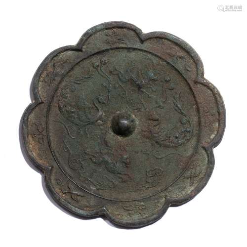 Bronze mirror Chinese, Han dynasty of lotus form with raised...