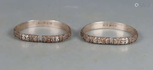 PAIR OF SILVER CAST BANGLES