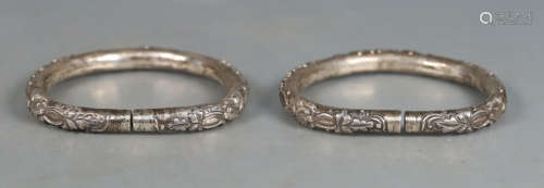 PAIR OF SILVER CAST BANGLES