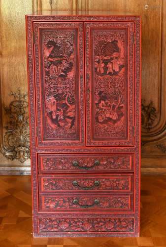 A GOOD CHINESE CARVED RED LACQUER STANDING CABINET, with dou...