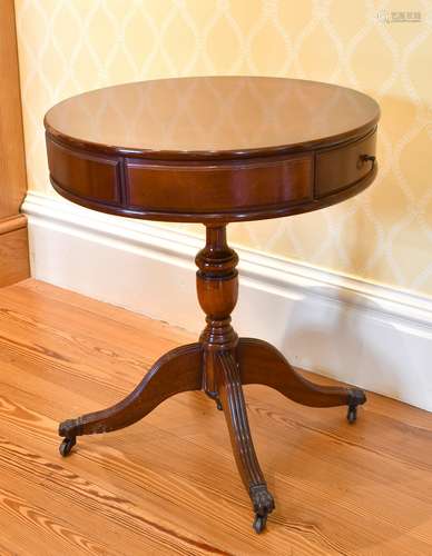 A REPRODUCTION MAHOGANY SMALL CIRCULAR TOP DRUM TABLE with t...