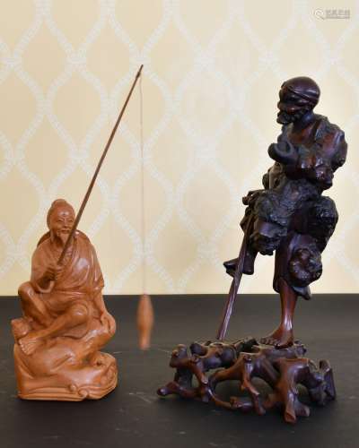A CHINESE CARVED WOOD ONI on a stand, and A CHINESE FISHERMA...