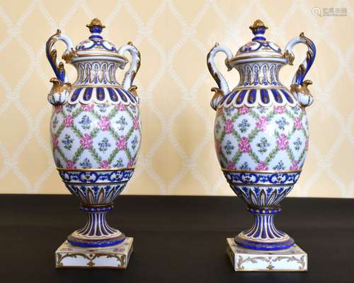 A PAIR OF SEVRES PORCELAIN TWO-HANDLED VASES AND COVERS spri...