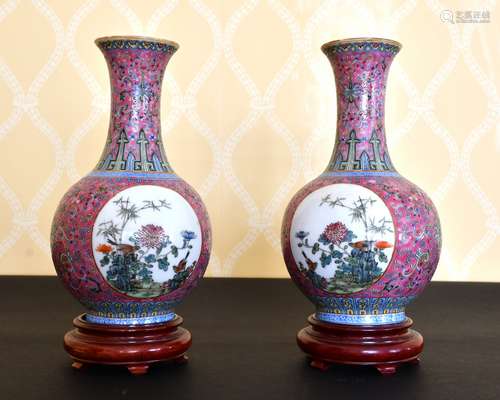 A PAIR OF CHINESE FAMILLE ROSE BULBOUS VASES with circular p...