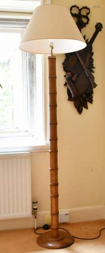 A BAMBOO TYPE STANDARD LAMP.