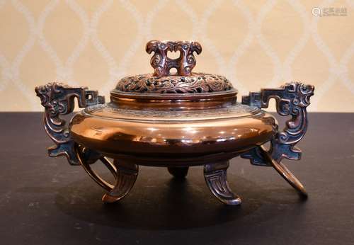 A CHINESE BRONZE CIRCULAR TWO-HANDLED KORO AND COVER.