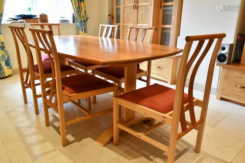 A MODERN DINING TABLE AND SIX CHAIRS, made of brown oak and ...