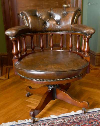 A GOOD MAHOGANY AND LEATHER TUB SWIVEL OFFICE CHAIR with but...