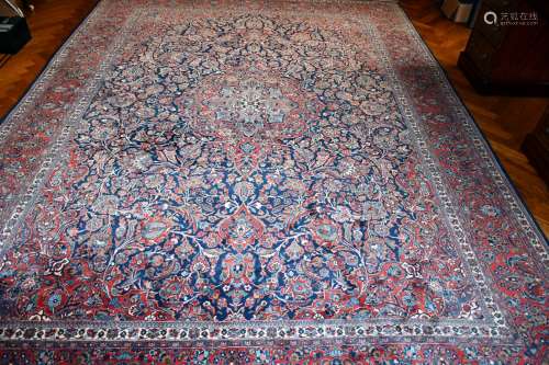 A VERY GOOD LARGE PERSIAN FLORAL CARPET, mainly in red and b...