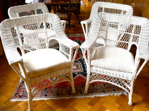 A SET OF FOUR WHITE PAINTED CANE ARMCHAIRS with loose cushio...