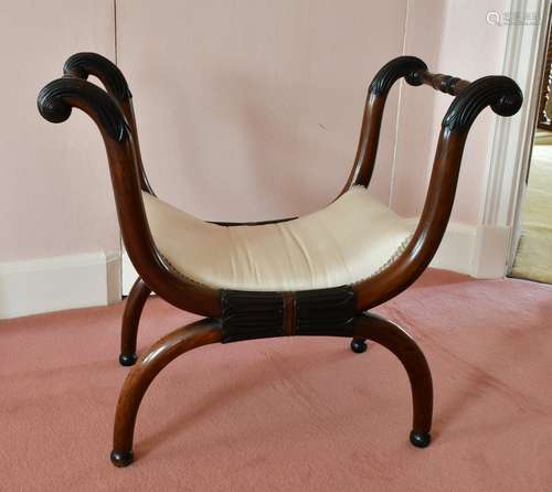 A MAHOGANY CROSS FRAME STOOL.