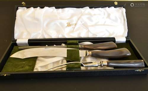 A CASED HARROD'S THREE PIECE CARVING SET.