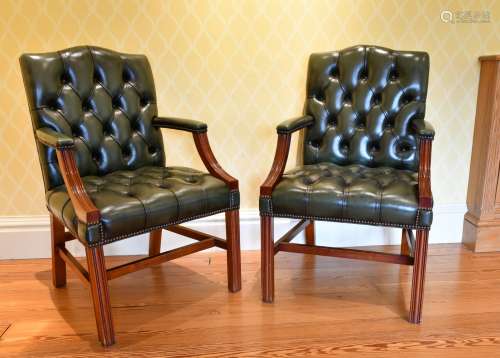 A GOOD PAIR OF MAHOGANY BUTTONED BACK ARMCHAIRS with curving...