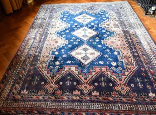 A GOOD PERSIAN RUG with three central diamond medallions. 7f...