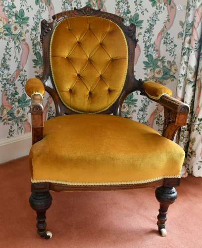 A VICTORIAN MAHOGANY BUTTON BACK ARMCHAIR.