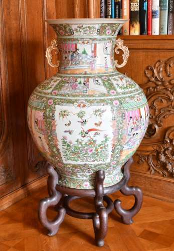 A LARGE CHINESE CANTON TWO-HANDLED BULBOUS VASE, on a wooden...