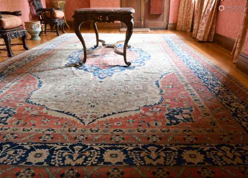 A GOOD LARGE WEST PERSIAN CARPET, probably SAROUK, at the en...