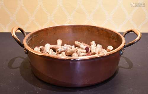 A COPPER TWO-HANDLED PAN.