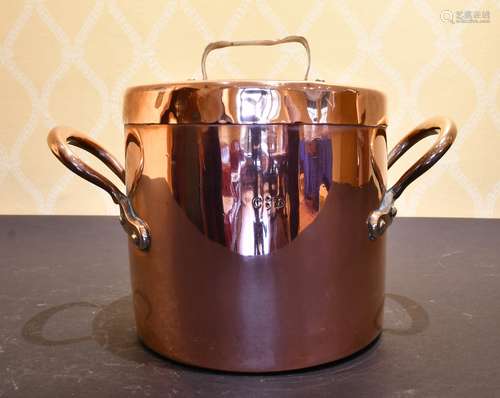 A COPPER TWO-HANDLED POT AND COVER.