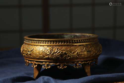 Ming dynasty, Xuan de style, gilt bronze tripod censer