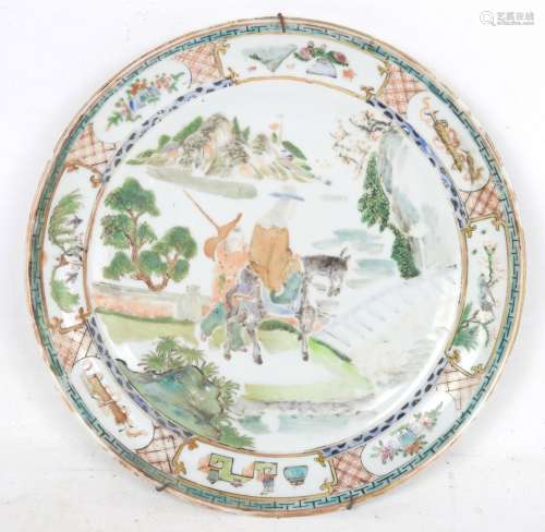 CHINE - XVIIIème siècle: Assiette en porcelaine à décor en é...