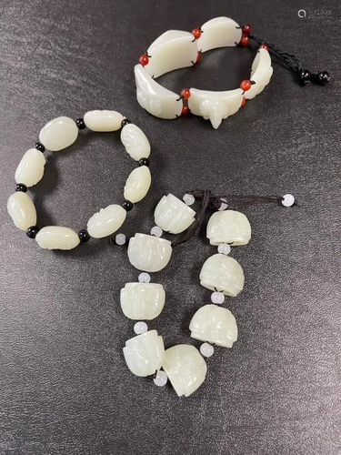 GROUP OF THREE CHINESE WHITE JADE BRACELETS