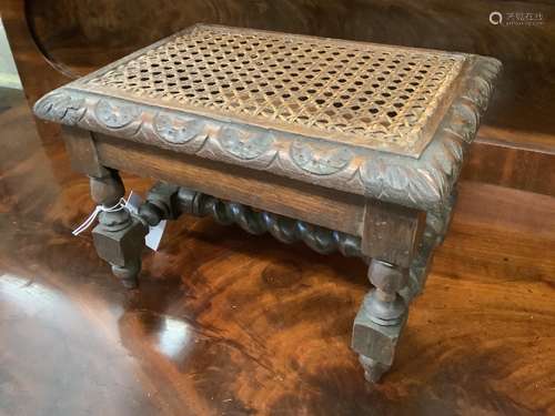 An early 20th century carved oak stool, width 29cm