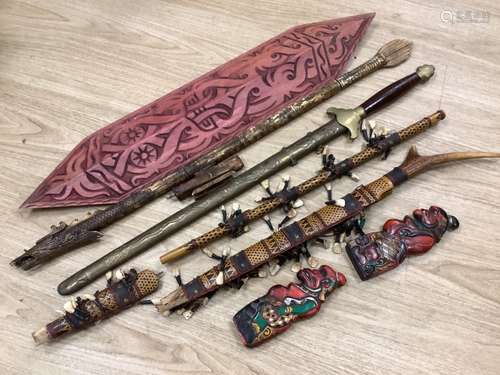 A group of Dayak Borneo tribal weapons and a Chinese sword