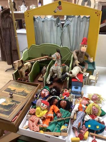 A collection of antique toys, to include a collection of pup...